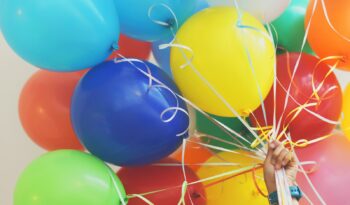 person holding balloons